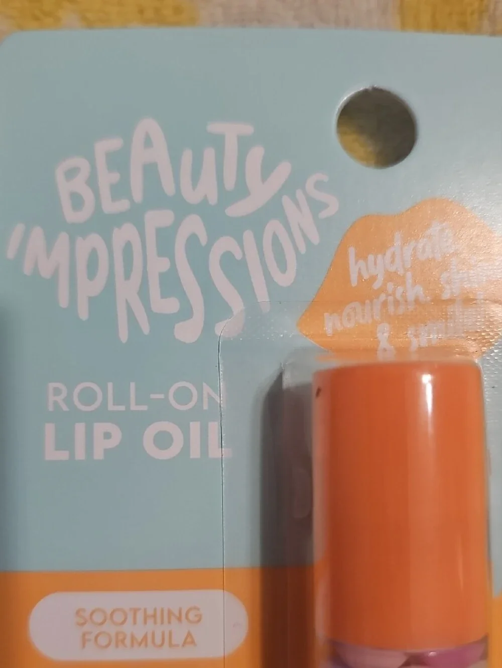 Impressions Roll-On Lip Oil in Orange Cap with Pastel Beads